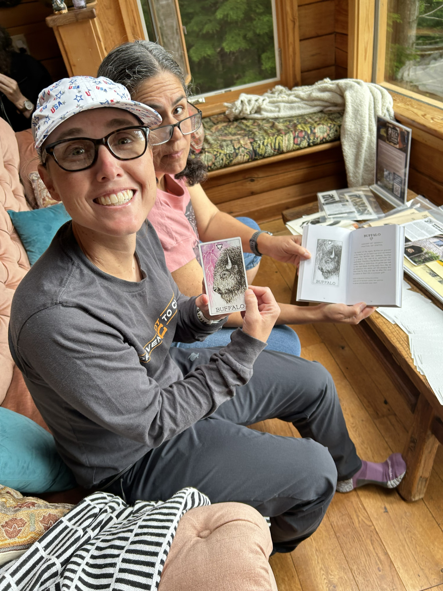 Two Wild N Well guests sharing an oracle card moment