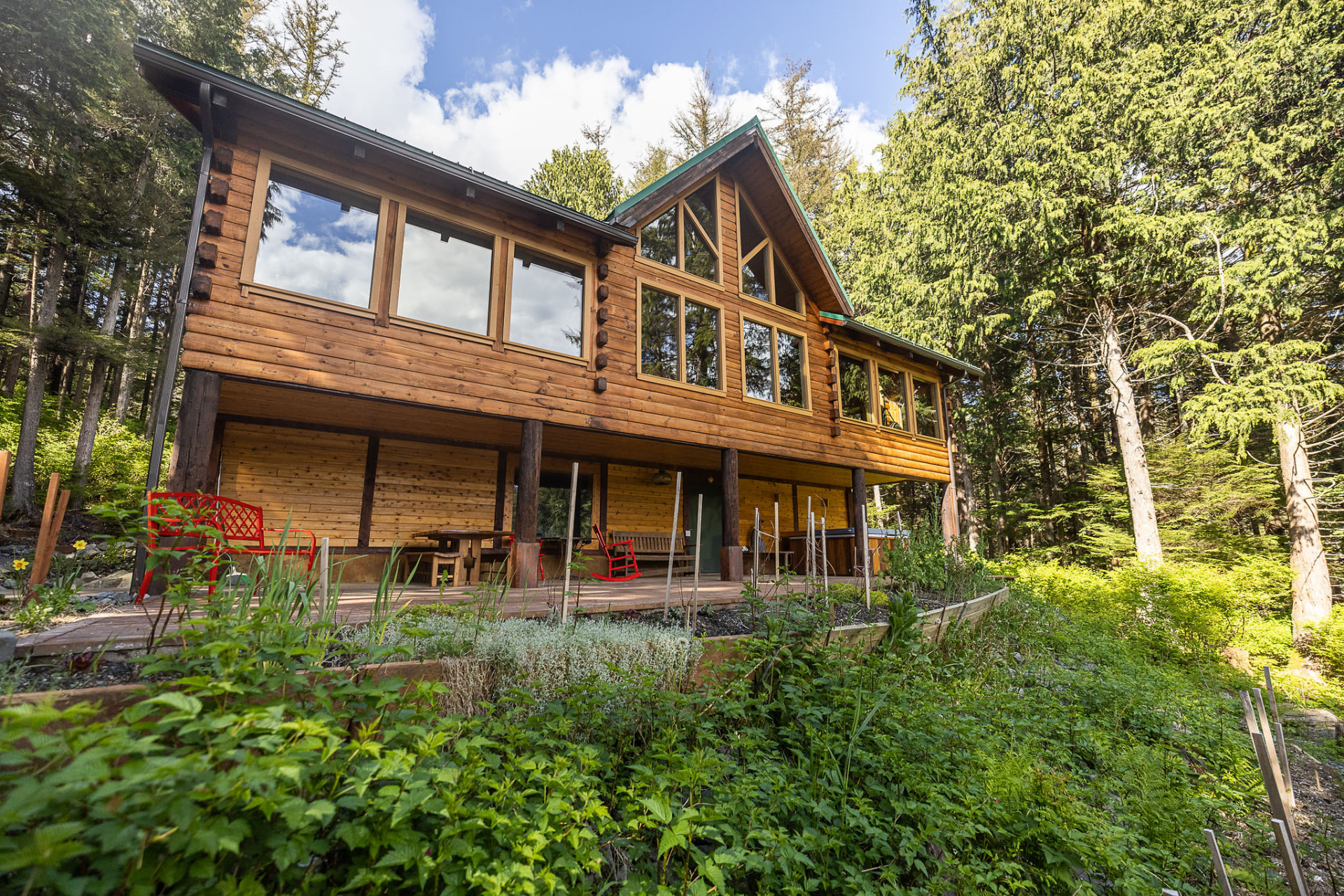 The Wild N Well retreat cabin surrounded by forest and gardens