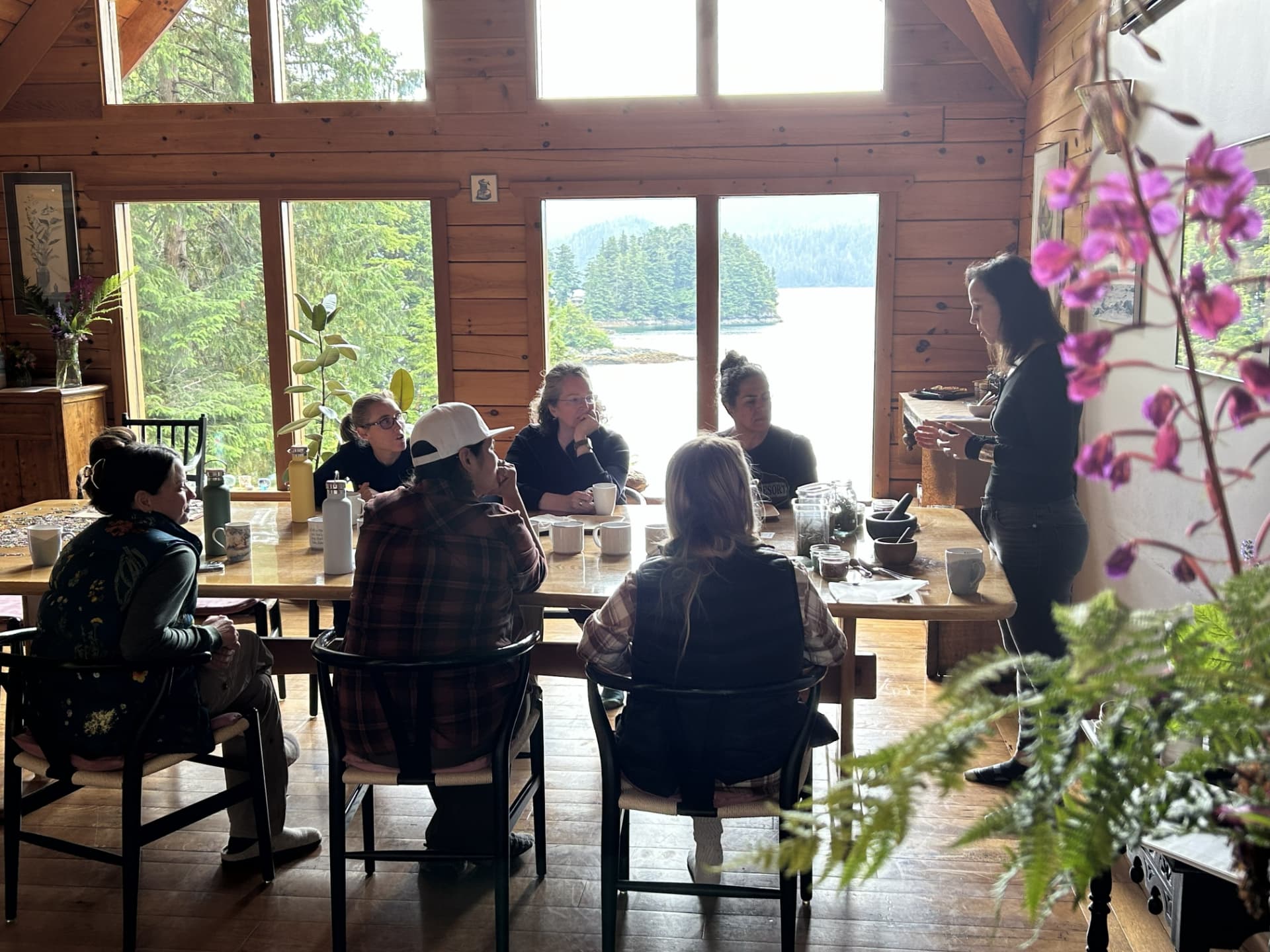 Guests gathered for a tea ceremony in the waterfront cabin