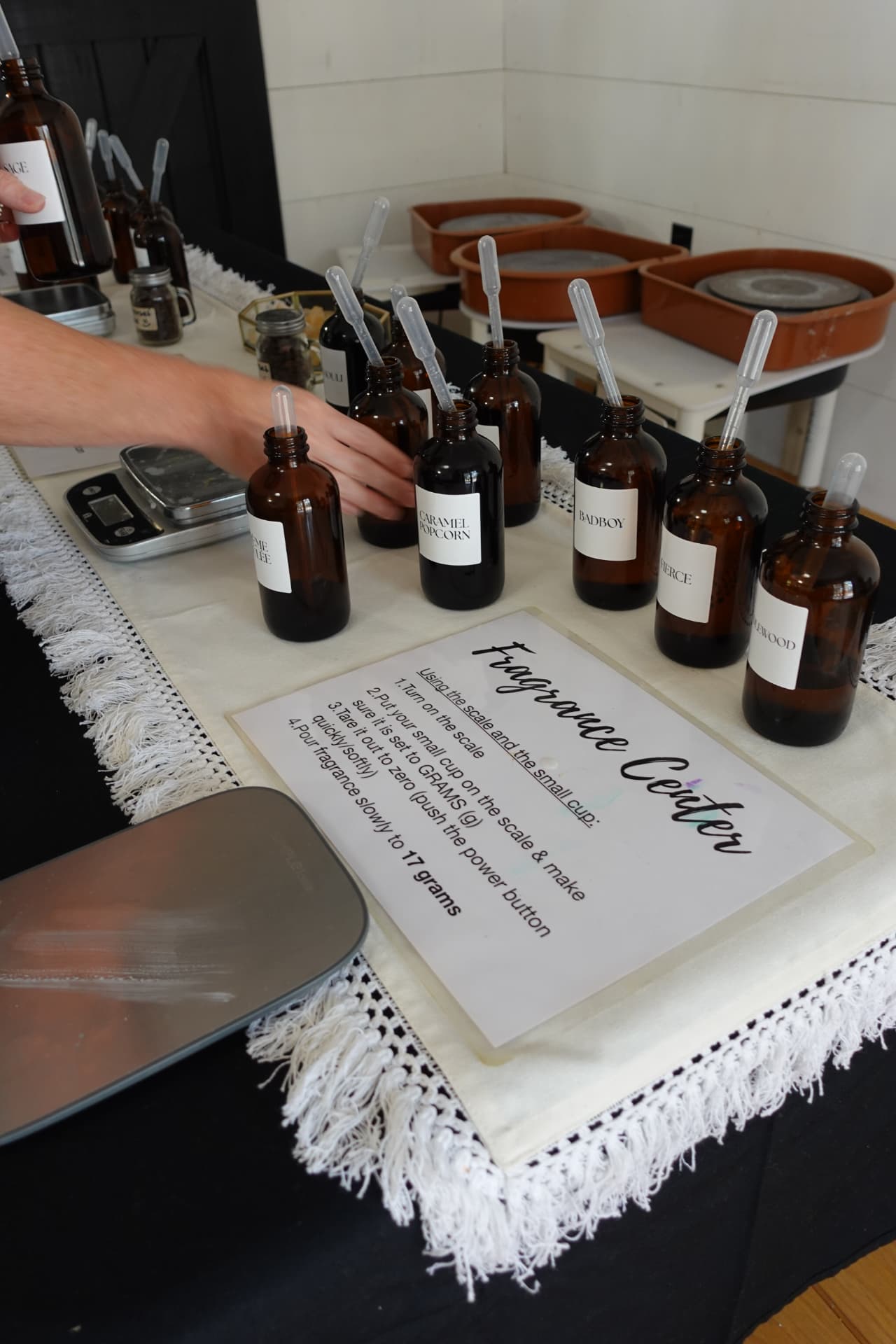 Amber fragrance bottles arranged for a hands-on scent-blending activity