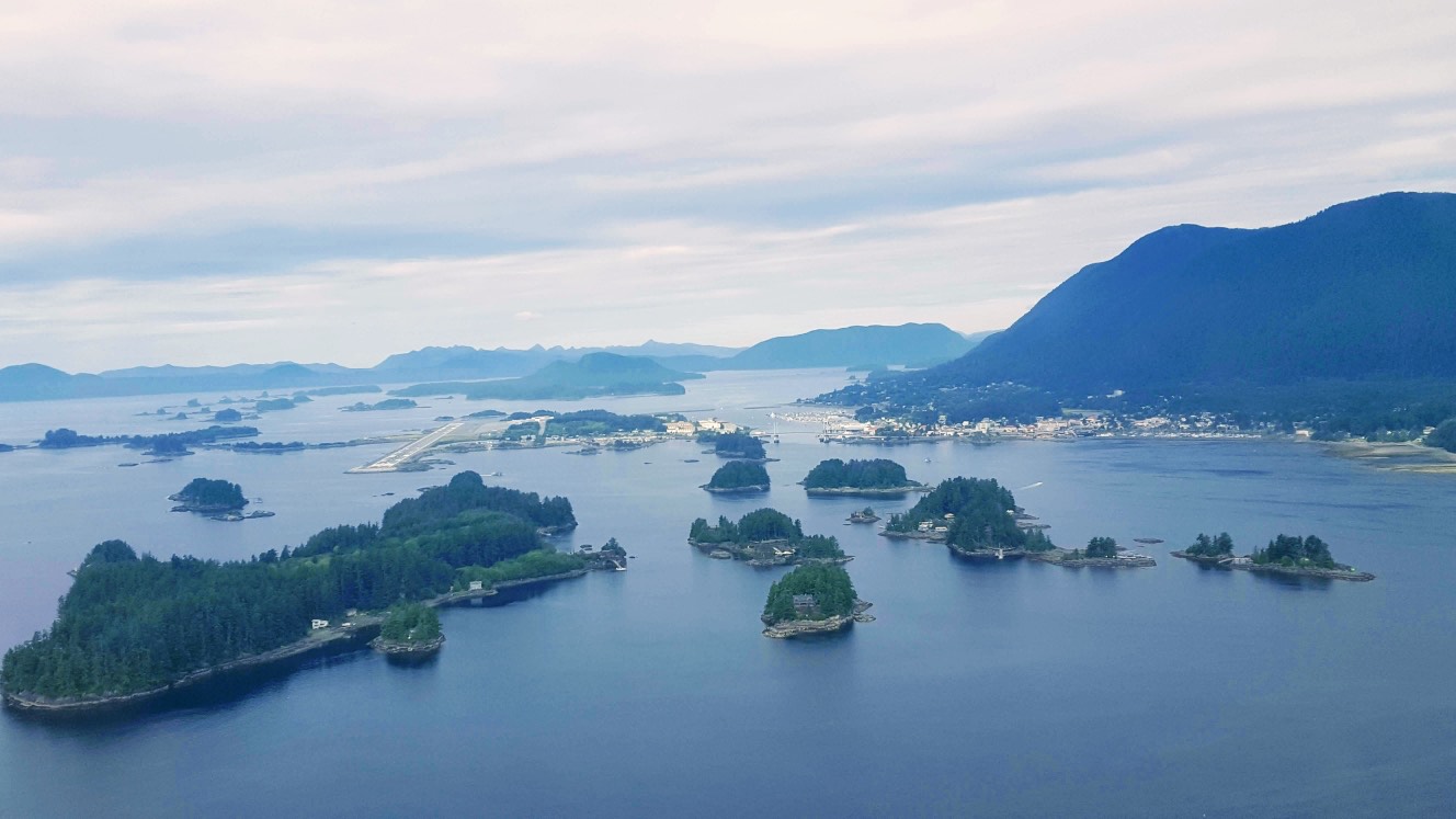 Aerial view of Sitka's forested islands, harbor and surrounding mountains