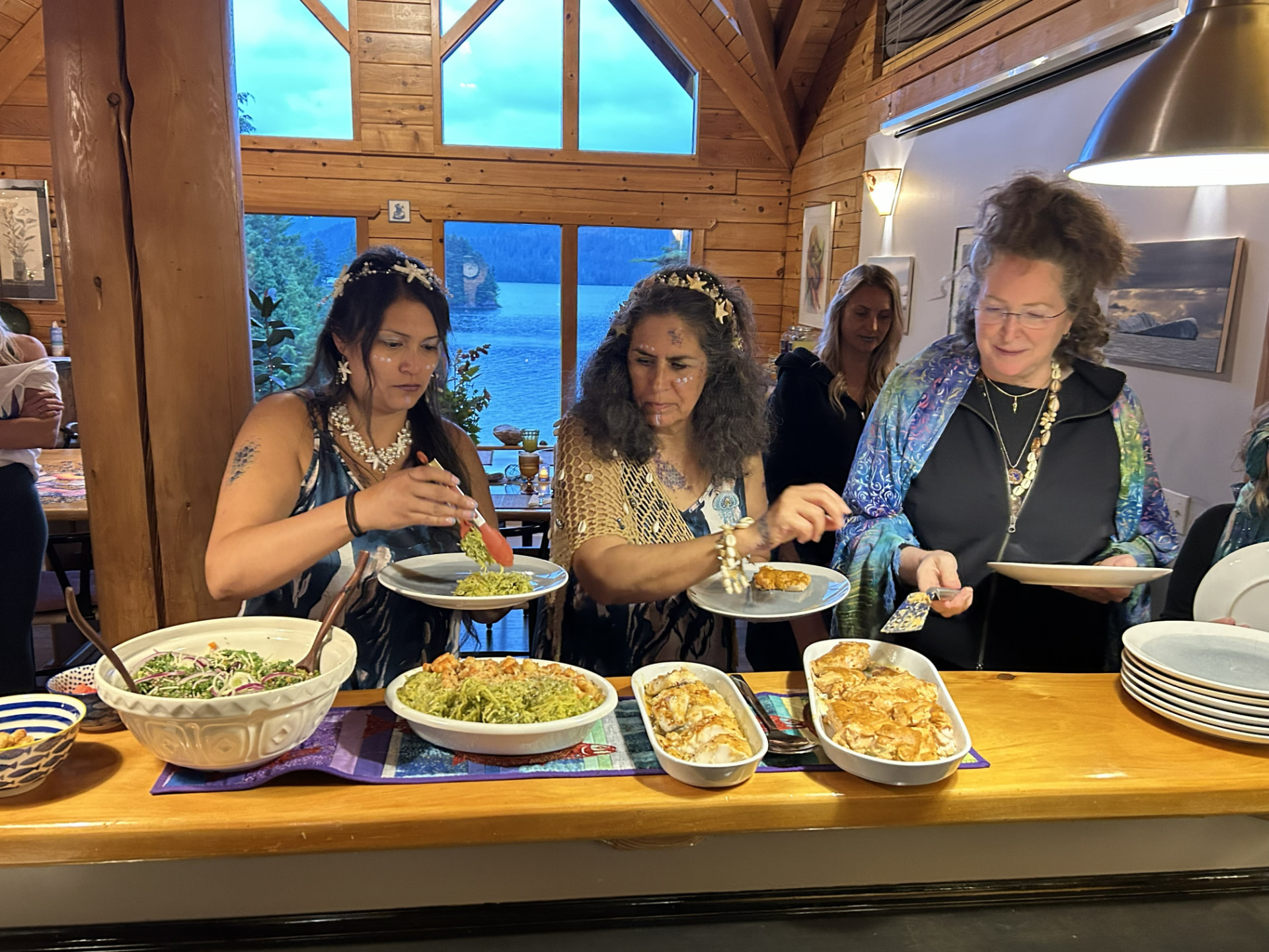 Wild N Well guests serving a colorful dinner together